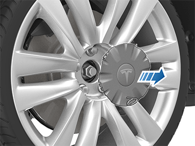 将轮毂螺母工具向外拉，以将轮毂螺母罩拆下